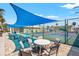 Outdoor community pickleball courts with shaded seating area, perfect for social play at 720 S Green Cir, Venice, FL 34285