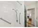 Walk in shower featuring accessible grab bars and a detachable shower head at 720 S Green Cir, Venice, FL 34285