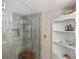 Modern shower with glass door, tiled walls, and a convenient built-in bench at 720 S Green Cir, Venice, FL 34285