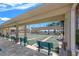 Outdoor shuffleboard courts with benches and covered seating area for residents and guests at 720 S Green Cir, Venice, FL 34285