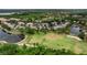 Expansive aerial view showcasing property near lakes, trees and other residential neighborhoods at 7637 Sweetbay Cir, Bradenton, FL 34203