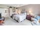 Relaxing bedroom features soft lighting, plush carpet, and neutral wall color at 7637 Sweetbay Cir, Bradenton, FL 34203