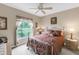 Comfortable bedroom with soft natural light and calming backyard view at 7637 Sweetbay Cir, Bradenton, FL 34203