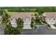 Attractive exterior of a multi-unit building with a well-manicured lawn and landscaping at 7637 Sweetbay Cir, Bradenton, FL 34203