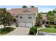 Attractive exterior of a multi-unit building with attached garages and well-maintained landscaping at 7637 Sweetbay Cir, Bradenton, FL 34203
