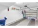 Clean garage featuring ample storage space and a well-maintained automatic door at 7637 Sweetbay Cir, Bradenton, FL 34203