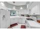 Bright white kitchen features plenty of counter space and modern appliances at 7637 Sweetbay Cir, Bradenton, FL 34203