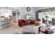 Cozy living room with comfortable seating, TV, and sliding glass doors to the patio at 7637 Sweetbay Cir, Bradenton, FL 34203