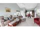 Inviting living room with vaulted ceilings, comfortable seating, and a bright, open layout at 7637 Sweetbay Cir, Bradenton, FL 34203