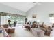 A cozy living room with comfortable furniture and a serene view of the outdoors at 7637 Sweetbay Cir, Bradenton, FL 34203