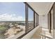 Balcony with large glass windows and views of the city at 770 Palm Avenue # 903, Sarasota, FL 34236