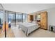 Bedroom featuring large windows with a view and a built-in cabinet at 770 Palm Avenue # 903, Sarasota, FL 34236