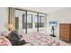 Bedroom with tile floor and large windows with view to the outside at 770 Palm Avenue # 903, Sarasota, FL 34236