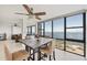Dining area with water views, seamlessly connected to the living room for open concept living at 770 Palm Avenue # 903, Sarasota, FL 34236