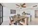 Dining area adjacent to kitchen, with a large window providing ample natural light at 770 Palm Avenue # 903, Sarasota, FL 34236