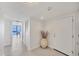 Bright entryway features tile flooring and a glimpse of the water view through the living area at 770 Palm Avenue # 903, Sarasota, FL 34236