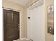 Hallway view showing the unit entrance door and elevator with fire safety instructions at 770 Palm Avenue # 903, Sarasota, FL 34236