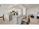 Bright kitchen features a large island with counter seating and stainless steel appliances at 770 Palm Avenue # 903, Sarasota, FL 34236