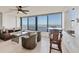 Cozy living room with water views, comfortable seating, and stylish decor at 770 Palm Avenue # 903, Sarasota, FL 34236