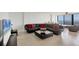 Bright living room offering beautiful water views, comfortable seating, and an inviting atmosphere at 770 Palm Avenue # 903, Sarasota, FL 34236