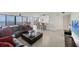 Spacious living room with stunning water views, an open layout, and modern decor at 770 Palm Avenue # 903, Sarasota, FL 34236