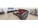 Comfortable living room with stylish furnishings, a wet bar, and neutral tile flooring at 770 Palm Avenue # 903, Sarasota, FL 34236
