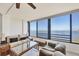 Comfortable living room featuring a large window with stunning views of the bay at 770 Palm Avenue # 903, Sarasota, FL 34236