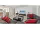 Open-concept living room with a large sofa, modern furnishings, and a view of the adjacent kitchen at 770 Palm Avenue # 903, Sarasota, FL 34236