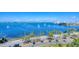 Expansive water view with sailboats on the bay, palm trees lining the shore, and city skyline in the background at 770 Palm Avenue # 903, Sarasota, FL 34236