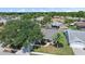 Charming home aerial view showcasing lush landscaping, a screened-in pool, and a well-manicured lawn at 7984 Glenbrooke Ln, Sarasota, FL 34243
