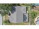 Birds eye view displaying a home with a screened pool and patio in a serene neighborhood at 7984 Glenbrooke Ln, Sarasota, FL 34243