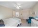 This bedroom features a closet, a ceiling fan and an accent chair at 7984 Glenbrooke Ln, Sarasota, FL 34243