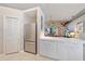 This kitchen features white cabinets and a stainless-steel refrigerator at 7984 Glenbrooke Ln, Sarasota, FL 34243