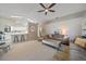 Spacious living room featuring neutral tones, vaulted ceilings, and adjoins the kitchen at 7984 Glenbrooke Ln, Sarasota, FL 34243