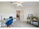 Bright office space with desk and lots of natural light spilling in with door looking onto main living area at 7984 Glenbrooke Ln, Sarasota, FL 34243