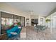This outdoor patio is covered and includes a dining area and a seating area at 7984 Glenbrooke Ln, Sarasota, FL 34243