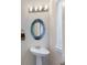 Pedestal sink in modern bathroom near window with natural light at 8191 Gabanna Dr, Sarasota, FL 34231