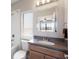 Bright bathroom features a vanity, shower and tub combo, and large mirror at 8191 Gabanna Dr, Sarasota, FL 34231