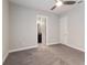 Bedroom featuring plush carpet and ceiling fan with an ensuite bathroom at 8191 Gabanna Dr, Sarasota, FL 34231