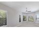 Bright bedroom with natural light, featuring large windows with views of lush greenery at 8191 Gabanna Dr, Sarasota, FL 34231