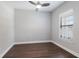Bedroom with wood floors, ceiling fan and a window with white blinds at 8191 Gabanna Dr, Sarasota, FL 34231
