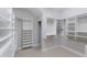 Spacious walk-in closet with ample shelving and organizational features for storage at 8191 Gabanna Dr, Sarasota, FL 34231