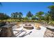 Outdoor fire pit area with comfortable seating, perfect for relaxing evenings at 8191 Gabanna Dr, Sarasota, FL 34231