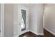 Elegant foyer with stylish front door featuring decorative glass panel and hardwood floors at 8191 Gabanna Dr, Sarasota, FL 34231