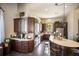 Clubhouse kitchen with dark wood cabinets and white countertops at 8191 Gabanna Dr, Sarasota, FL 34231