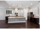 Modern kitchen featuring granite countertops, stainless steel appliances, and a large island at 8191 Gabanna Dr, Sarasota, FL 34231