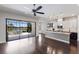 Open floor plan with spacious living room, modern kitchen featuring granite countertops and island at 8191 Gabanna Dr, Sarasota, FL 34231