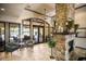 Inviting lobby with stone fireplace, comfortable seating, and views of the outdoors at 8191 Gabanna Dr, Sarasota, FL 34231