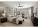 Elegant main bedroom with neutral tones, plush carpeting, lots of natural light, and sitting area at 8191 Gabanna Dr, Sarasota, FL 34231