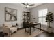 Well-lit home office featuring a desk, bookshelves, comfortable chair, and natural lighting at 8191 Gabanna Dr, Sarasota, FL 34231
